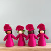 4 felt Petunia Flower Fairies wearing magenta dresses and Petunia flowers on their heads with varied skin tones | © Conscious Craft